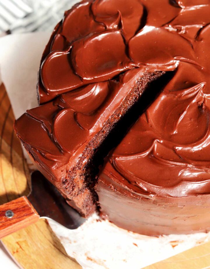 the best moist chocolate cake with slice cut out
