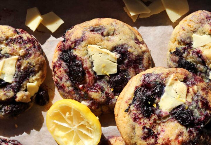 lemon blueberry cookies on baking sheet with white chocolate chunks