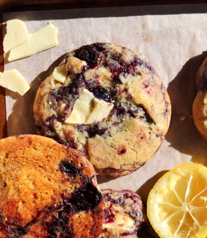 lemon blueberry cookies on baking sheet with white chocolate chunks
