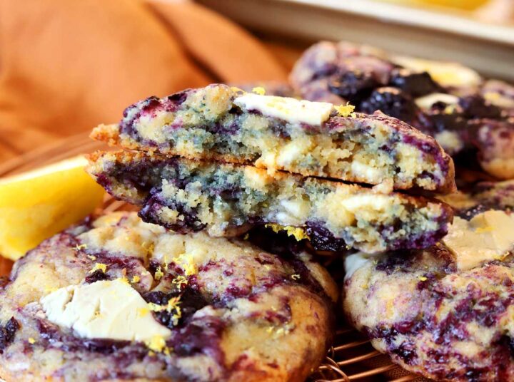 lemon blueberry cookies broken in half showing chewy insides