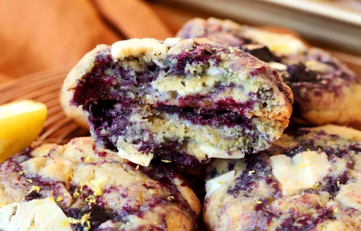 lemon blueberry cookies broken in half showing chewy insides