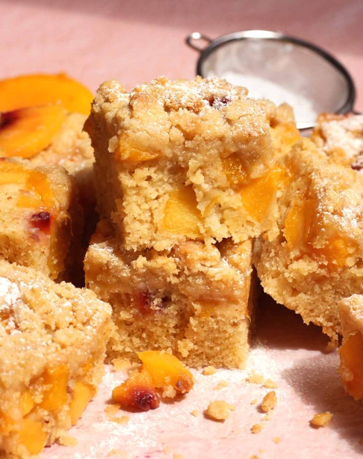 stack of peach crumb cake slices