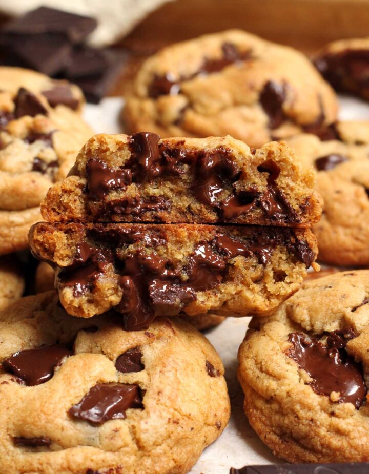 thick brown butter chocolate chunk cookies split in half showing cross section