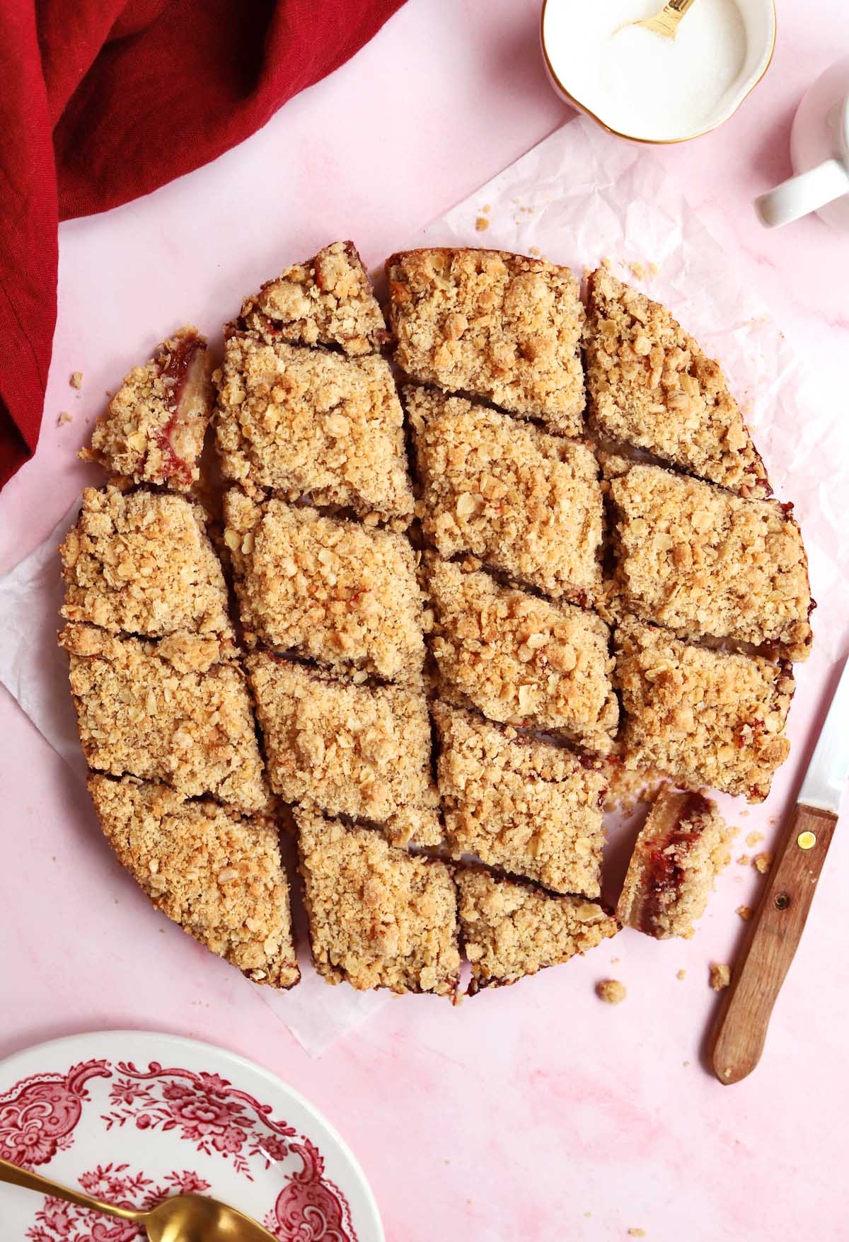 strawberry crisp bars sliced into diamonds on parchment