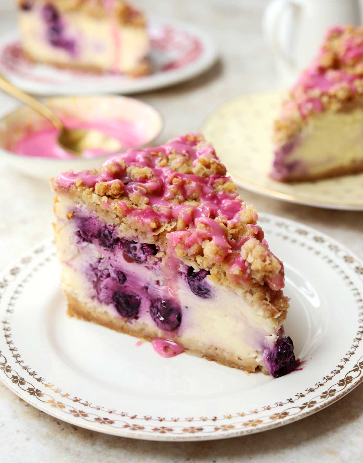 blueberry crumble cheesecake slice on a plate