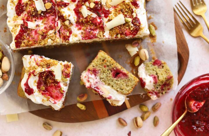top view of raspberry pistachio cake slice showing cross section