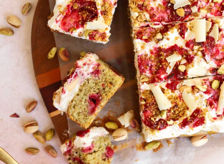 top view of raspberry pistachio cake slice showing cross section