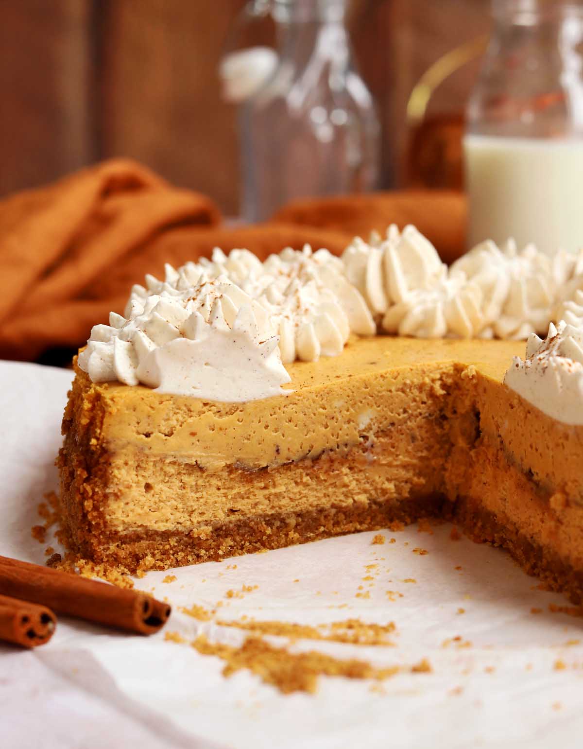side view of cinnamon swirl pumpkin cheesecake showing cross section