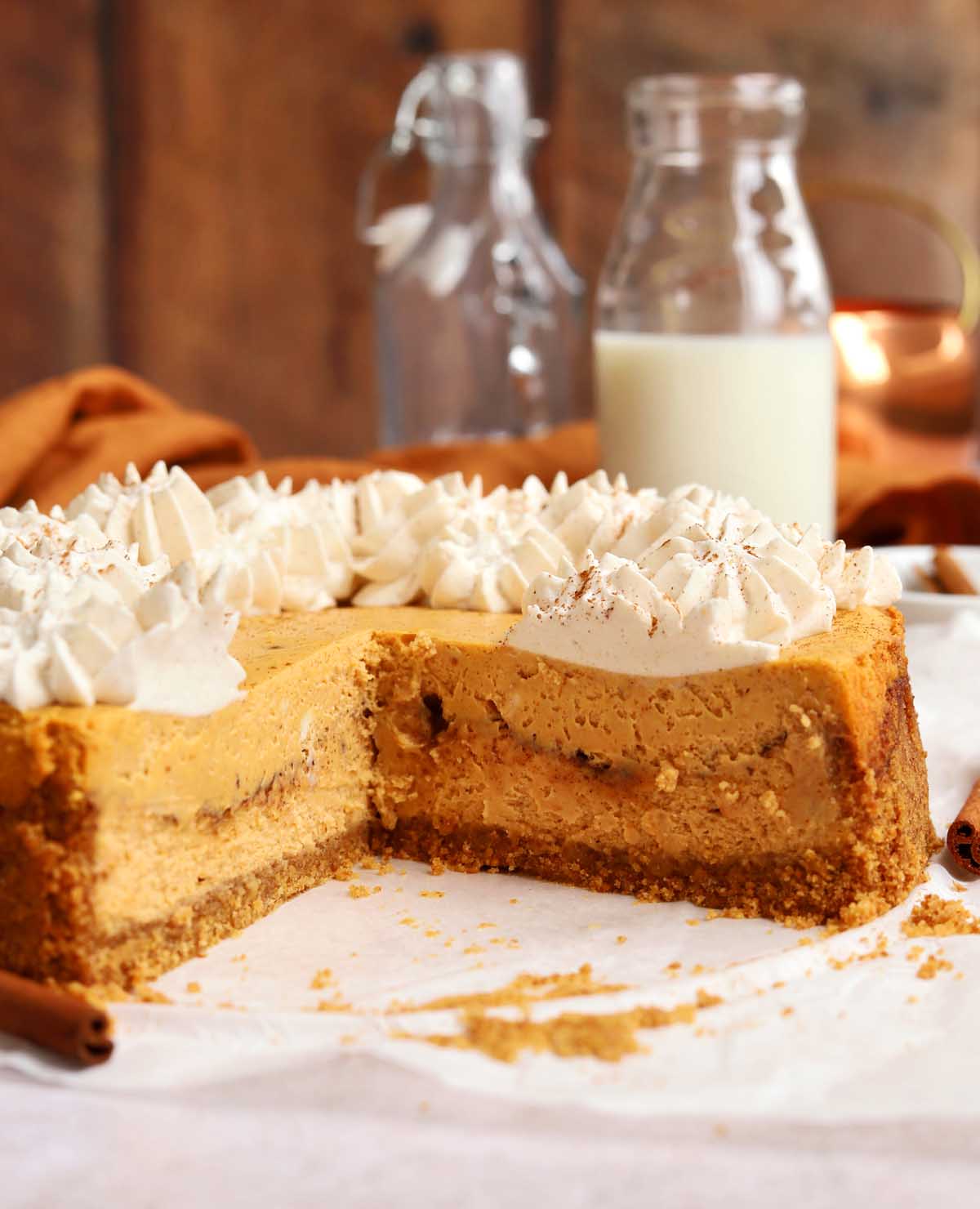 side view of cinnamon swirl pumpkin cheesecake showing cross section