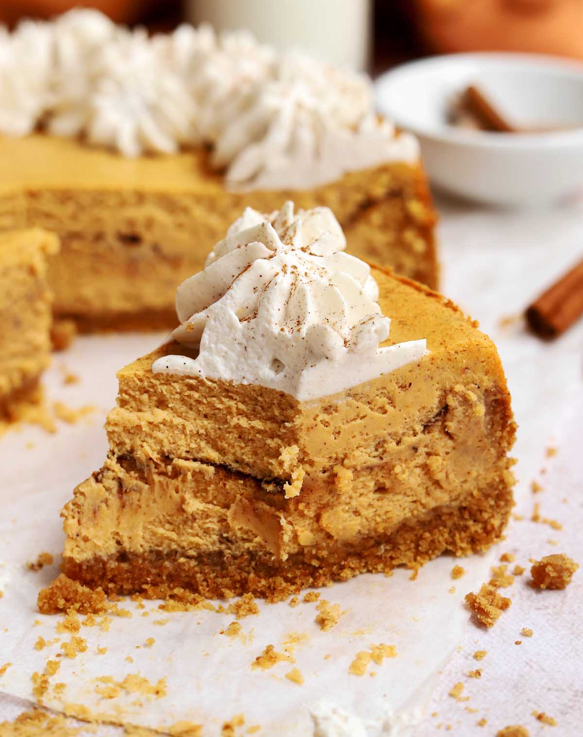 cinnamon swirl pumpkin cheesecake with bite