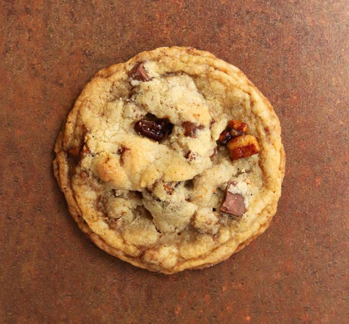 top view of brown butter pecan praline cookies piled up on table