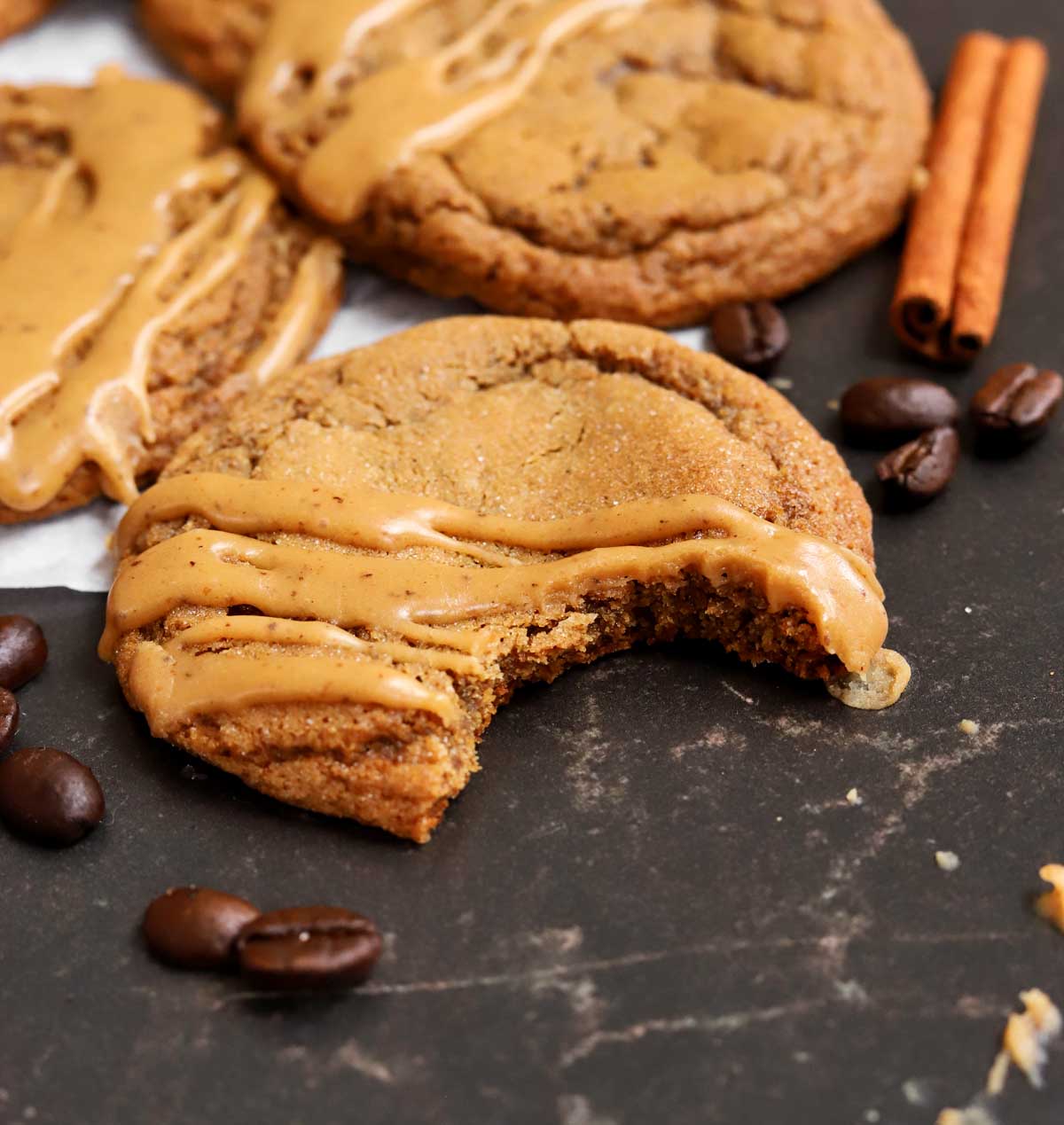 soft gingerbread latte cookie with bite showing soft chewy insides