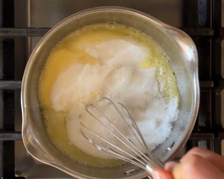 homemade toffee bits: Add sugar and salt to partially melted butter in a saucepan.