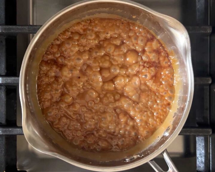Cook until it turns golden brown while whisking constantly. The mixture becomes less frothy and more smooth. 