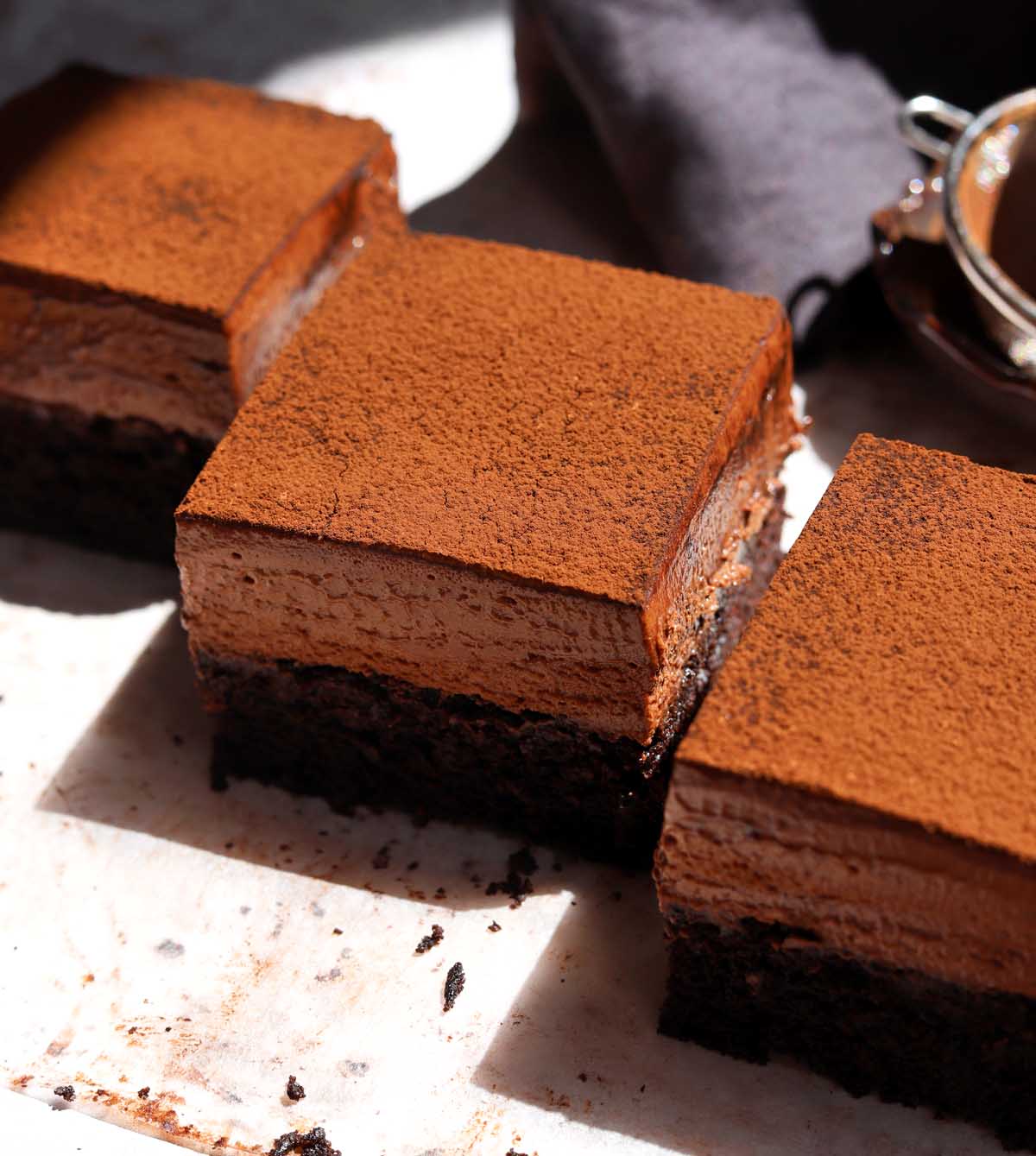 three slices of chocolate mousse cake