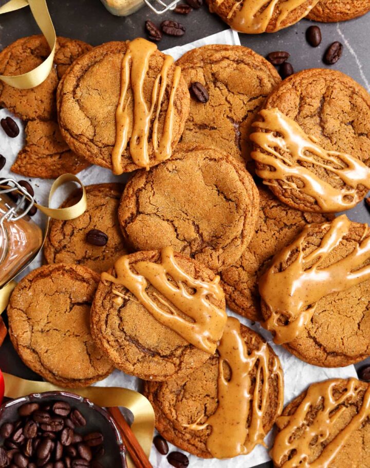 glazed soft gingerbread latte cookies piled up on parchment paper