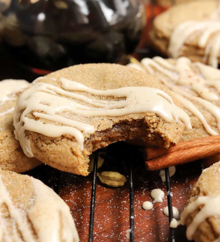 vanilla maple chai latte cookies on cooling rack with bite