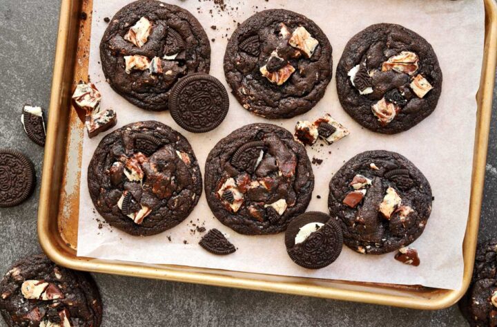 top view of double chocolate cookies and cream cookies on baking sheet