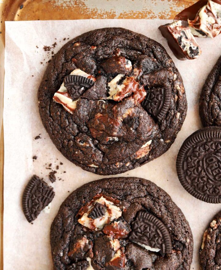 top view of double chocolate cookies and cream cookies on baking sheet