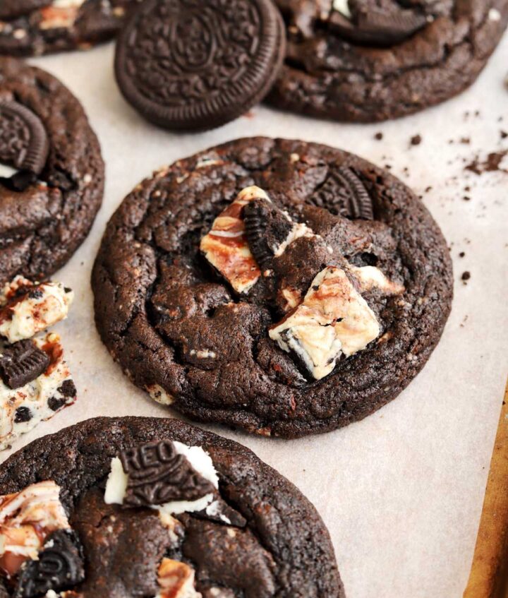angle view of double chocolate cookies and cream cookies on baking sheet