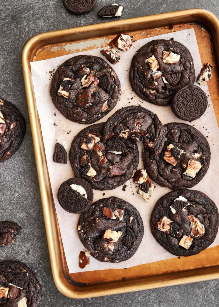 top view of double chocolate cookies and cream cookies on baking sheet