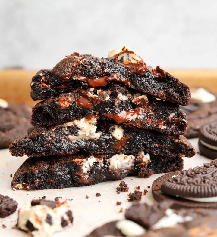 stack of double chocolate cookies and cream cookies showing fudgy center