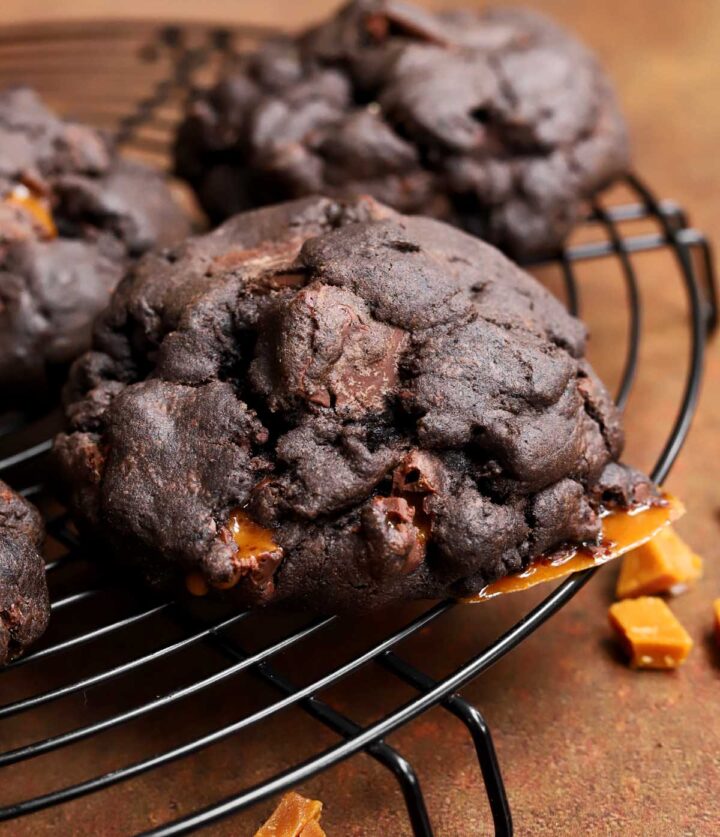 levain bakery coffee toffee cookies on a cooling rack