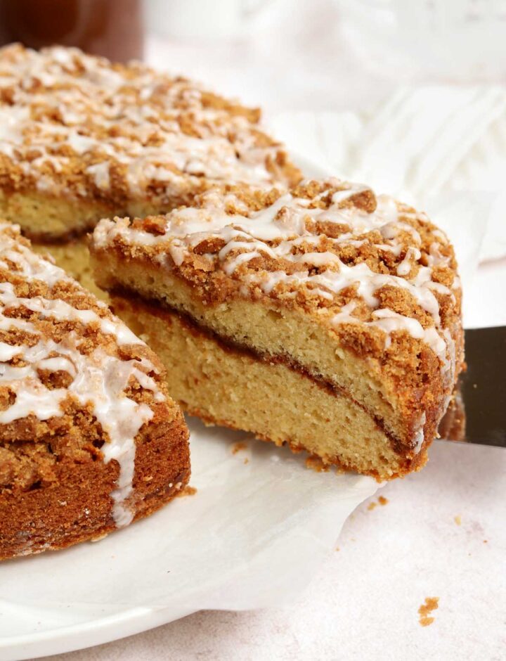 sour cream coffee cake on plate with slice cut out