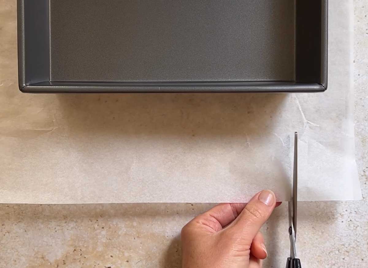 Make a cut inwards towards the corner of pan where it reaches the point.