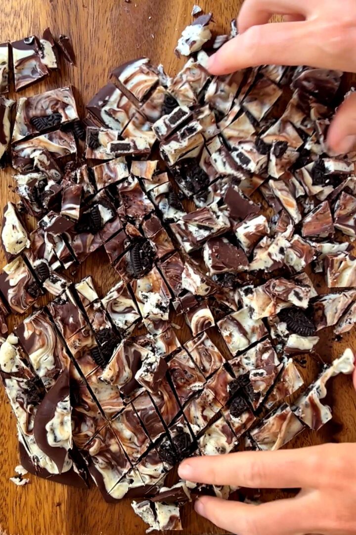 cookies and cream chocolate bark chopped on cutting board