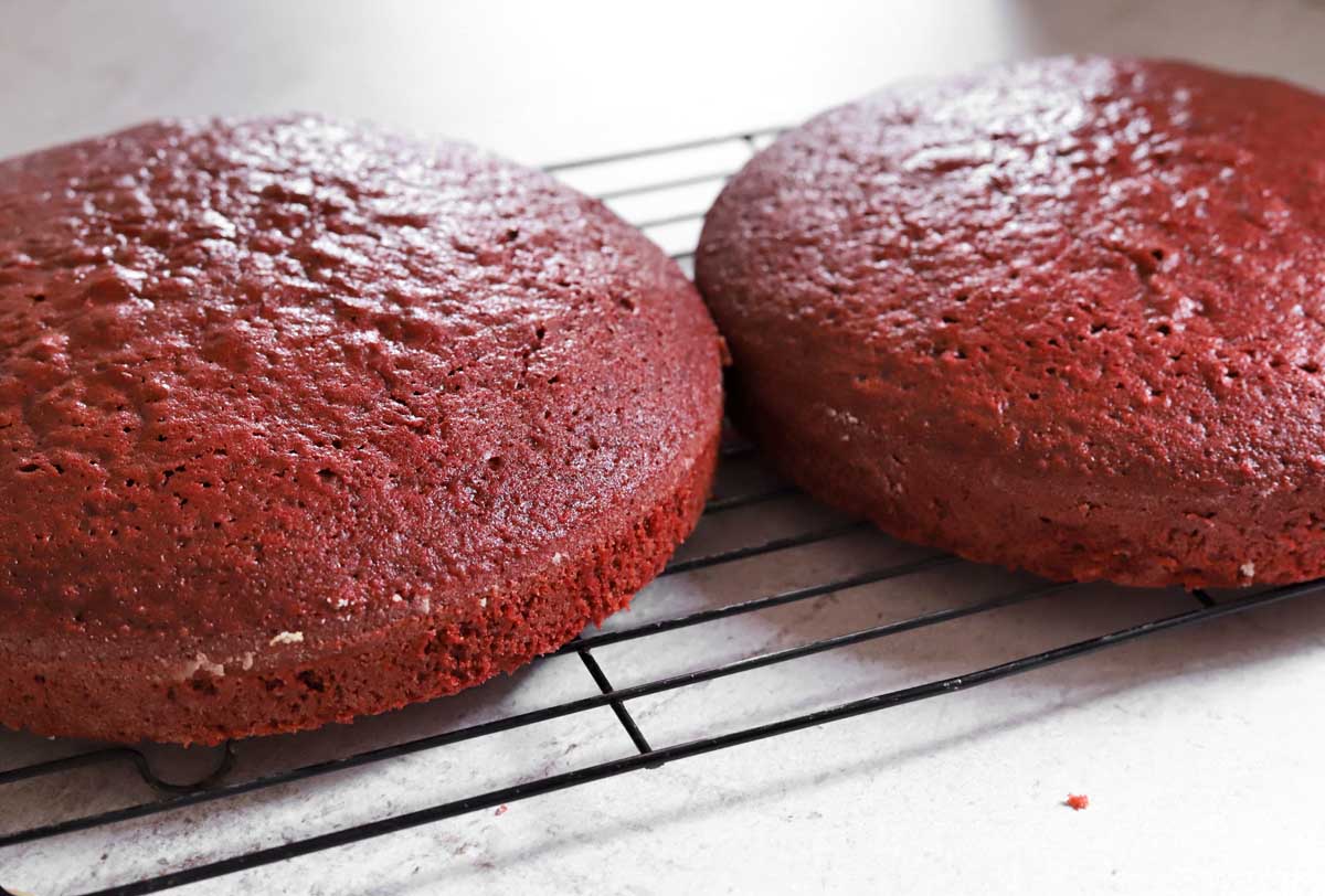 red velvet cake layer cooling on wire rack