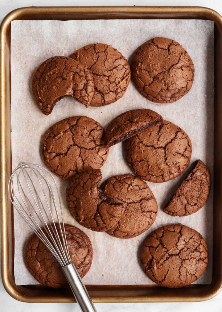 fudgy molten brownie cookies on baking sheet