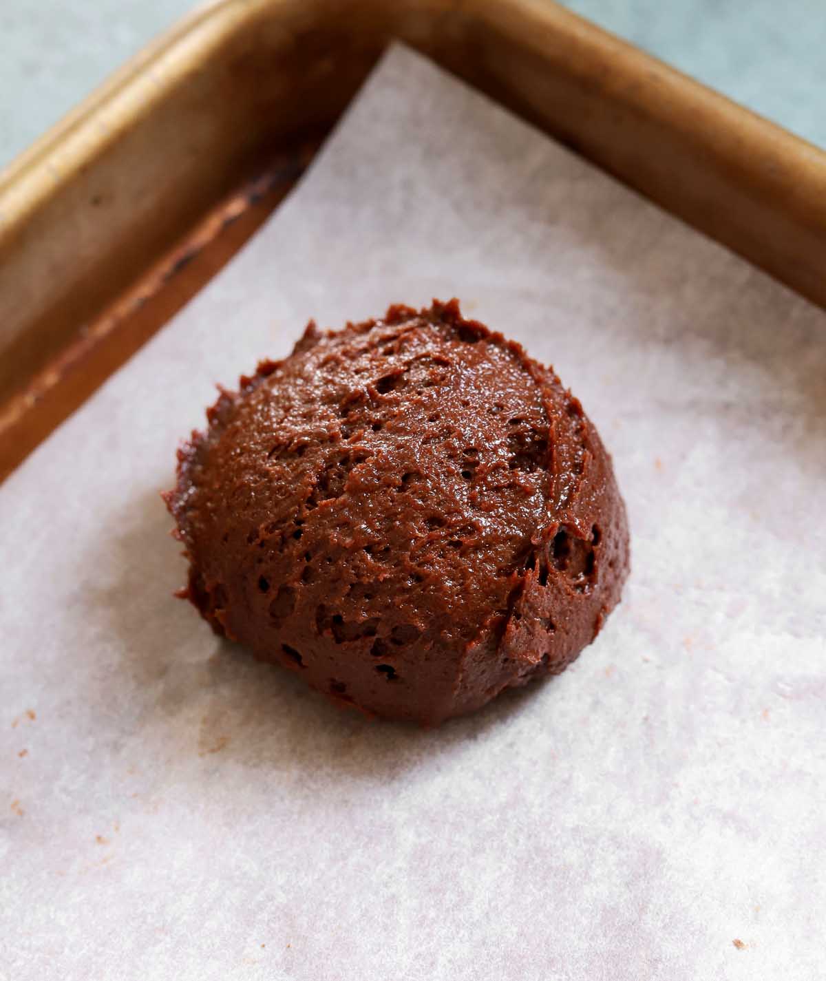 chocolate fondant cookie batter scooped onto baking sheet