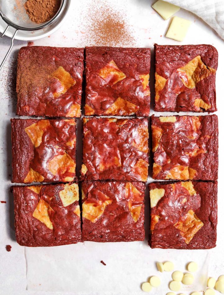 red velvet brownies sliced on parchment paper