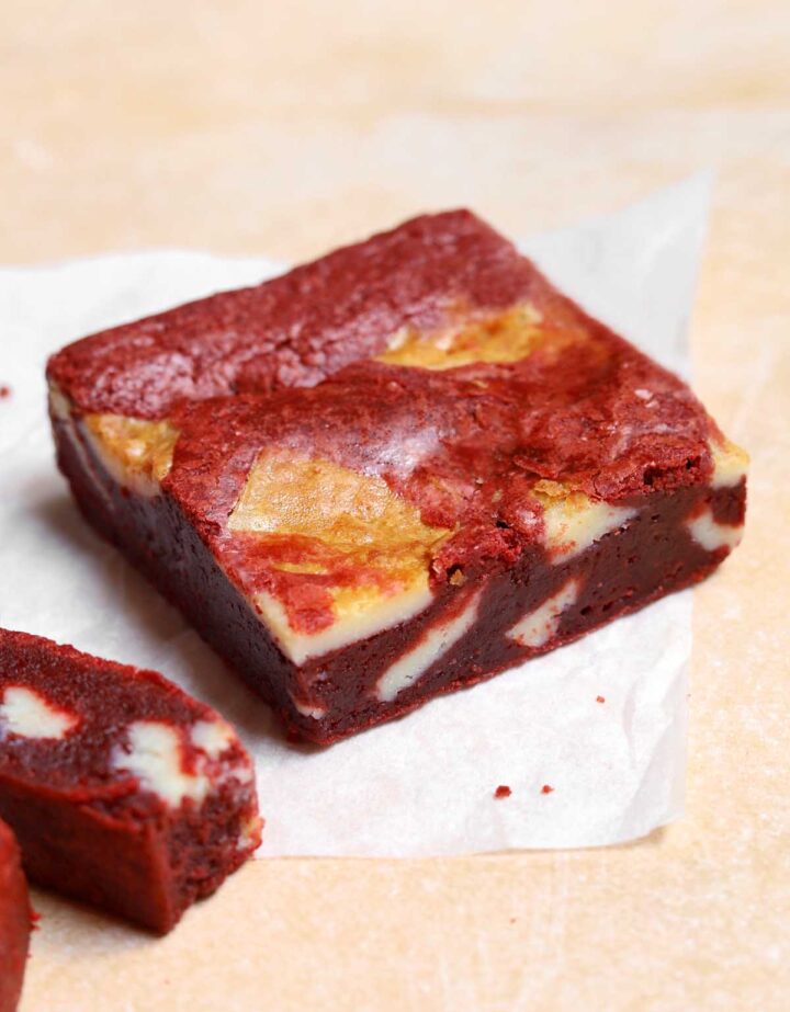 red velvet brownie slice on parchment paper