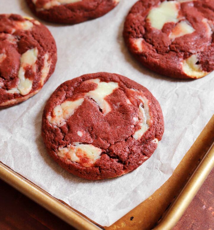 red velvet cookies on parchment-lined baking sheet