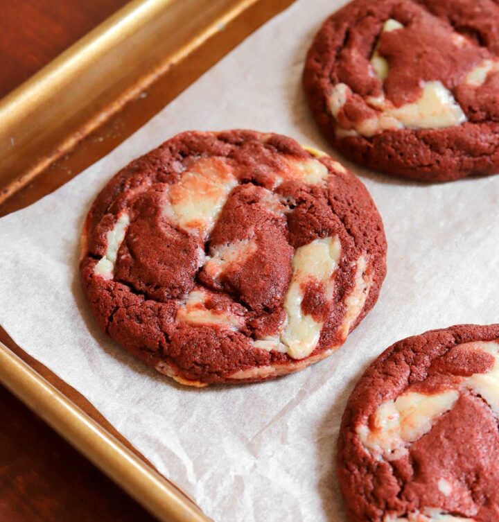 red velvet cookies on parchment-lined baking sheet