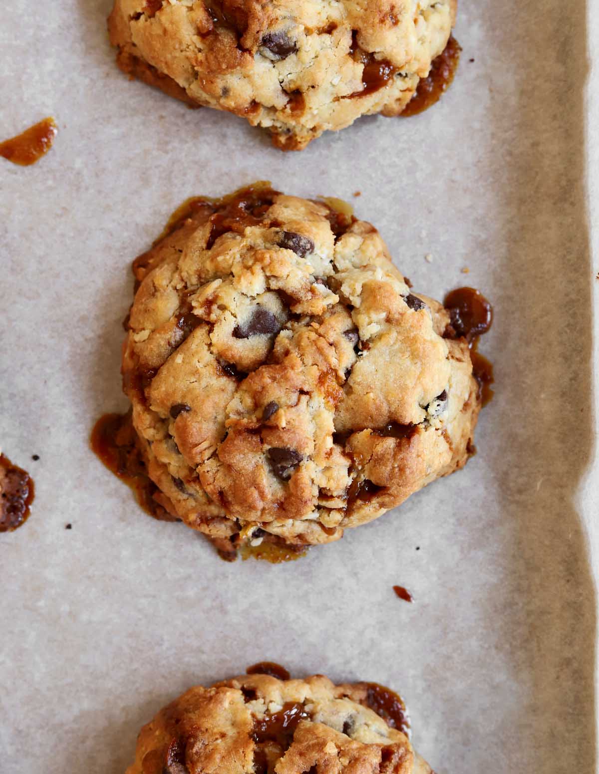 top view of levain bakery caramel coconut cookies on baking sheet
