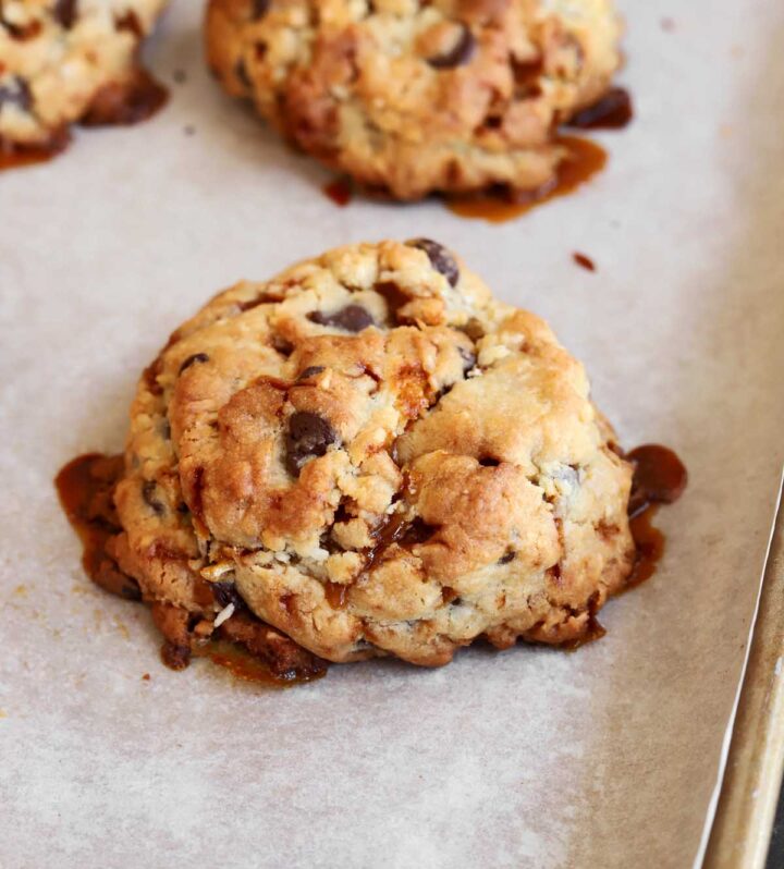 angle view of levain bakery caramel coconut cookies on baking sheet