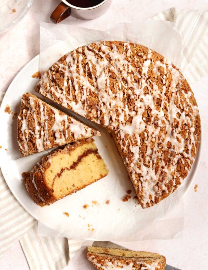 sour cream coffee cake sliced on plate showing cross section with cinnamon crumb filling
