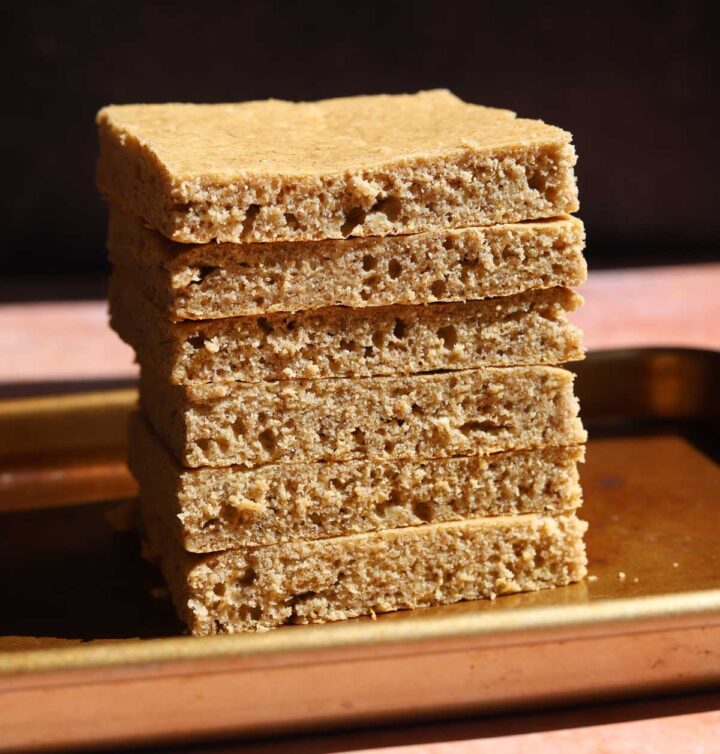 sugar free smash cake layer stacked on baking sheet