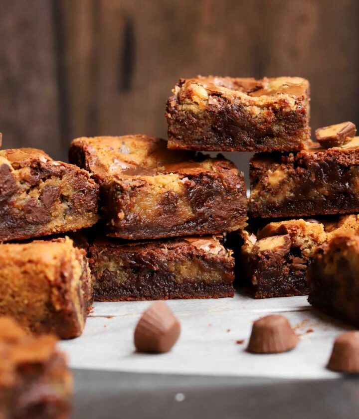 peanut butter brookies squares stacked on parchment paper