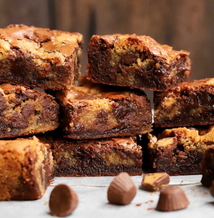 peanut butter brookies squares stacked on parchment paper