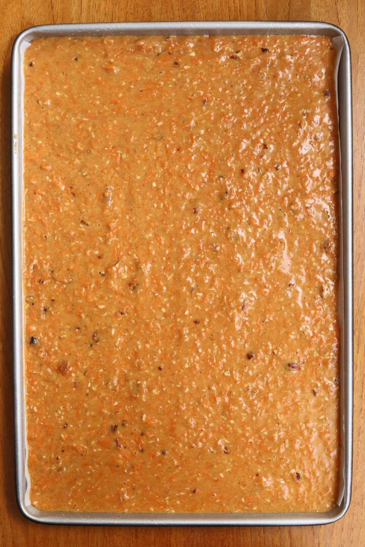 carrot cake batter in a sheet pan before baking