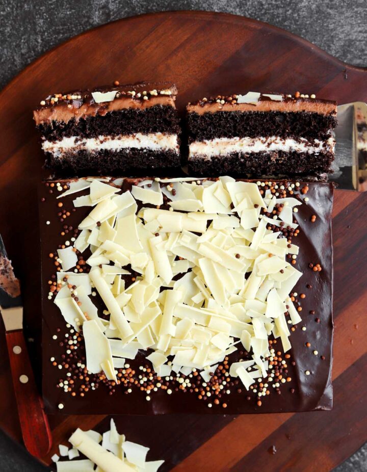 top view of tuxedo cake with two slices showing fillings