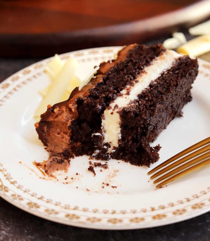 tuxedo cake slice on a plate with bite