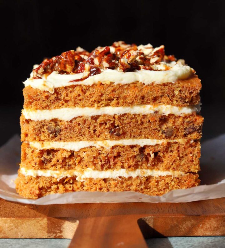 praline crunch carrot cake layer cake on a cutting board