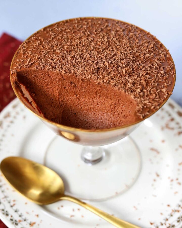 one ingredient chocolate mousse in dessert cup with spoon showing airy texture