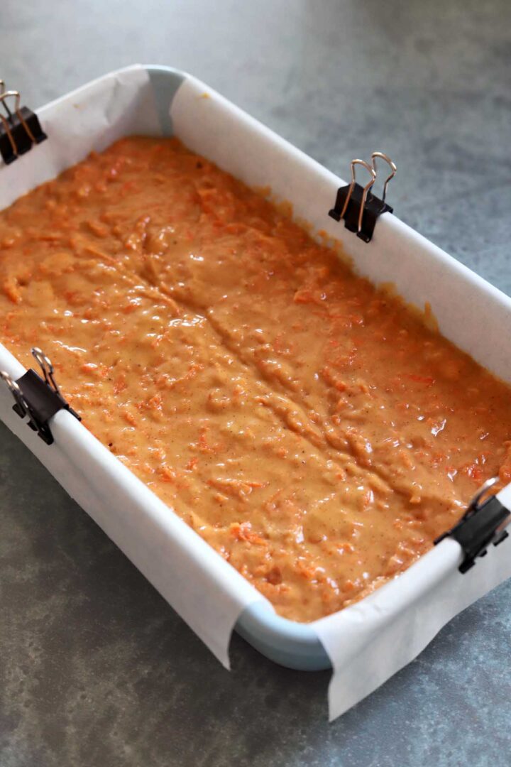 carrot cake loaf cake batter in loaf pan before baking