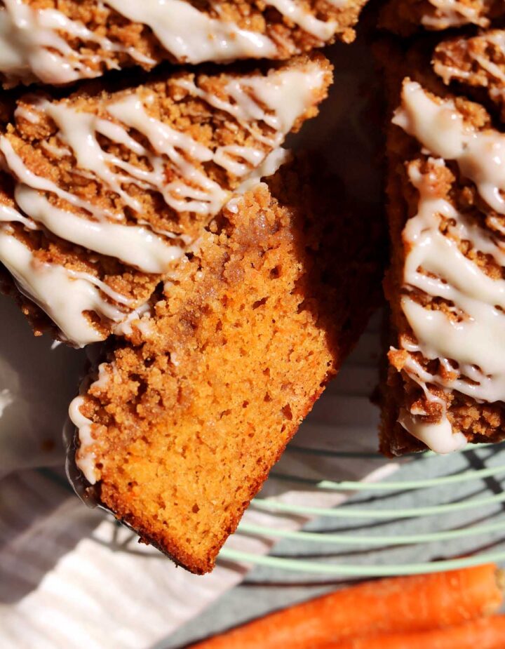 top view of carrot cake coffee cake sliced on wire rack
